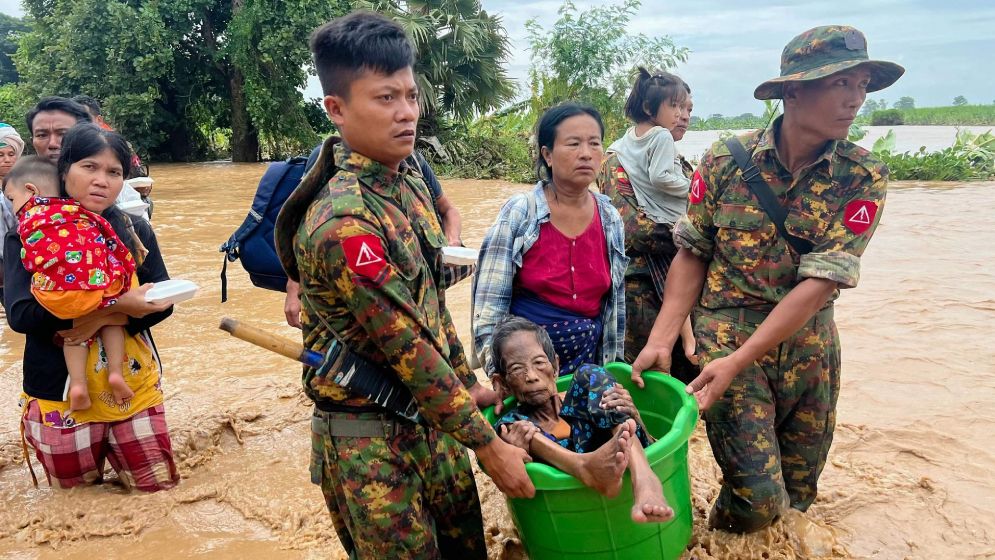 এক হেলিকপ্টার থেকে খাবার, আরেকটি থেকে গুলি