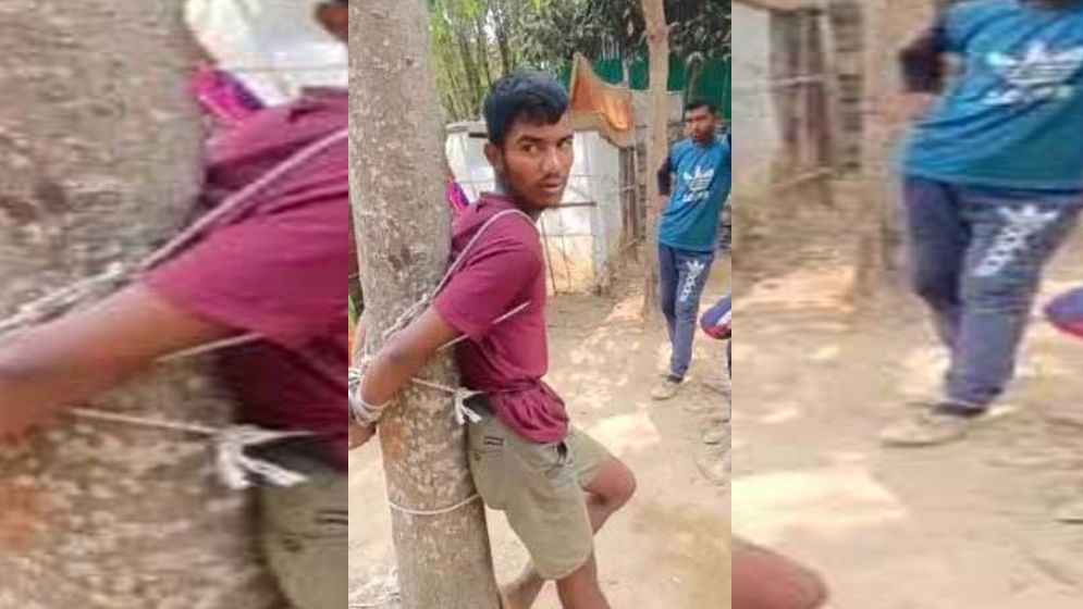 চুরির দায়ে গাছে বেঁধে  যুবককে পুলিশে সোর্পদ করল এলাকাবাসী